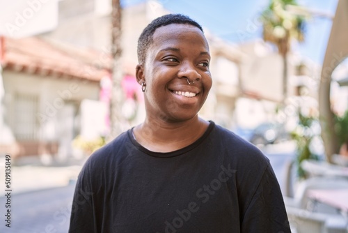 Young african american transgender smiling confident at street © Krakenimages.com