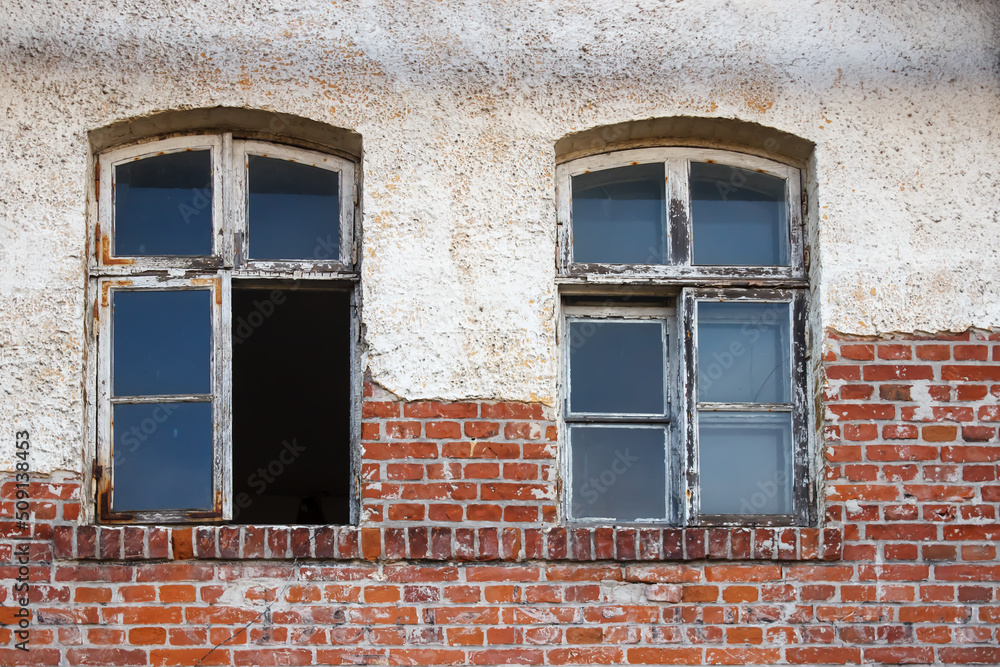 windows of old abandoned decaying house