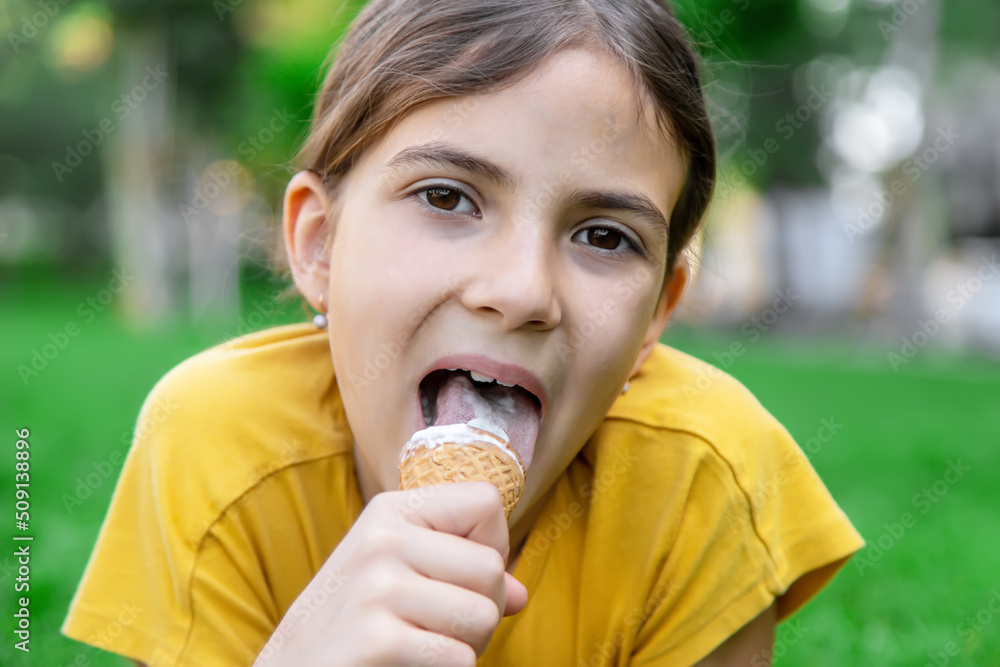 children eat ice cream in the park.selective focus children eat ice cream in the park.selective focus