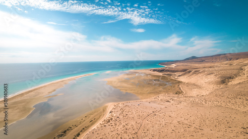 Stunning aerial drone shot of sunny Playa de Sotavento de Jandía, Fuerteventura, beach, spain