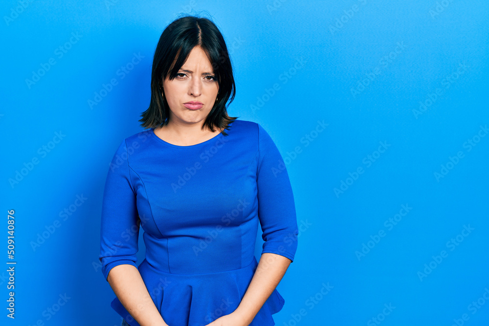 Young hispanic woman wearing casual clothes skeptic and nervous, frowning upset because of problem. negative person. Young hispanic woman wearing casual clothes skeptic and nervous, frowning upset because of problem. negative person.