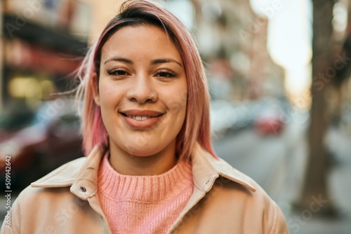 Young hispanic girl smiling happy standing at the city. Free Download Young hispanic girl smiling happy standing at the city. - GFXLoad