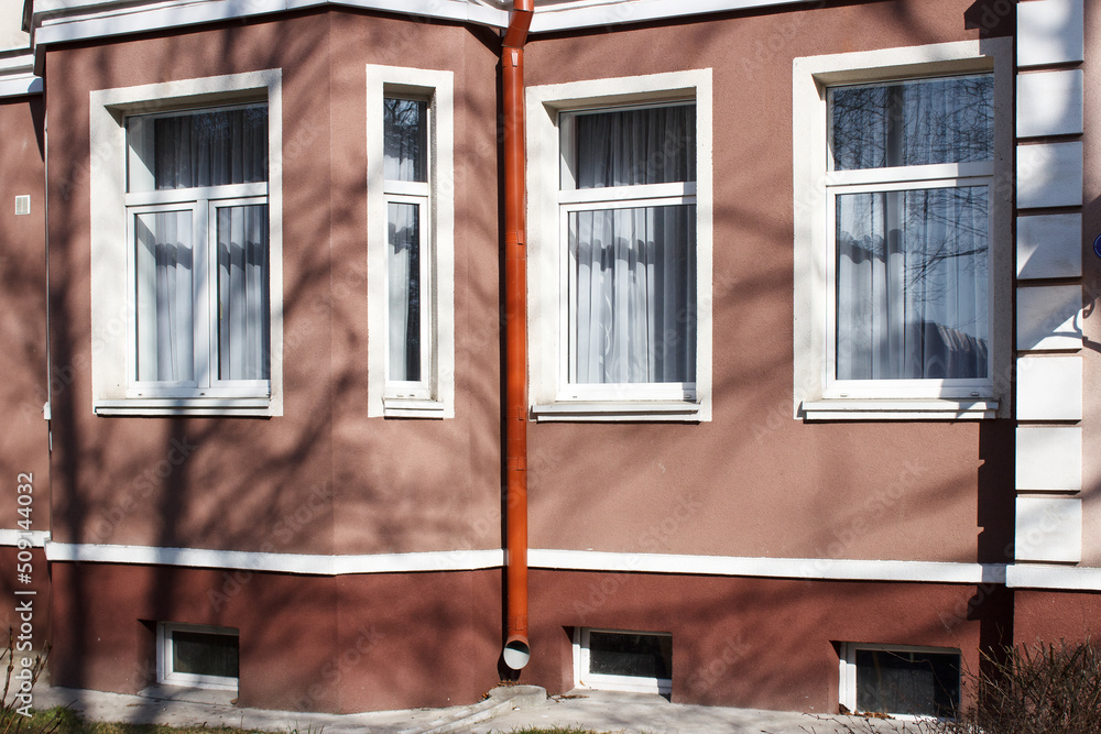Fototapeta premium modern plastic windows in the wall of the house