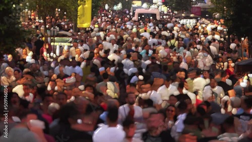 Crowded pedestrians walking on the big street time lapse. Unrecognisable people walking in Taksim Square. Blurred pedestrian walking fast. 