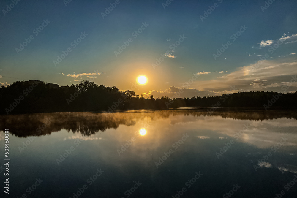 fog over lake water surface at sunset in summer fog over lake water surface at sunset in summer