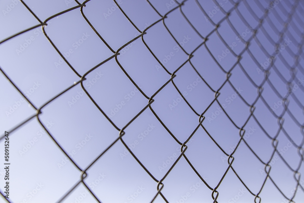 Fototapeta premium Metal fence with sky