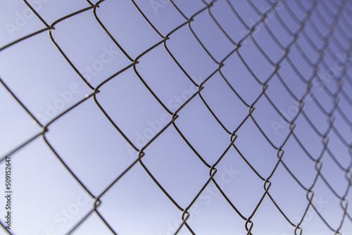 Metal fence with sky