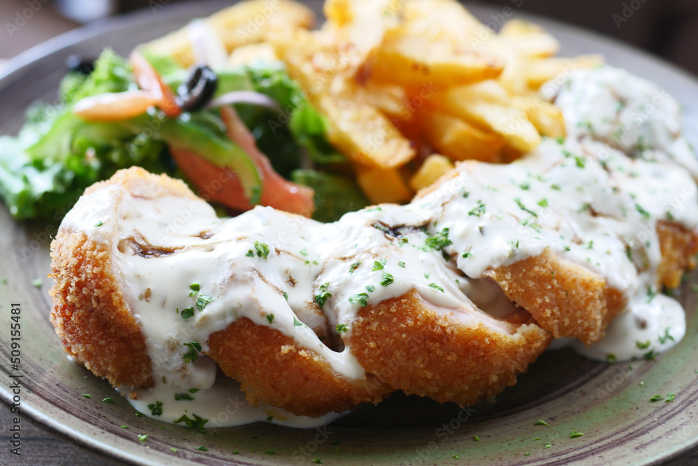 Chicken Cordon Bleu and Mayonnaise on table Chicken Cordon Bleu and Mayonnaise on table