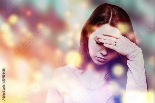 Migraine aura, Portrait of a young woman suffering from headache, epilepsy or other problem photo