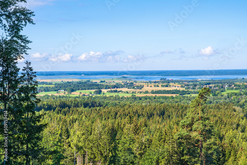 View at a forest and a countryside with a lake