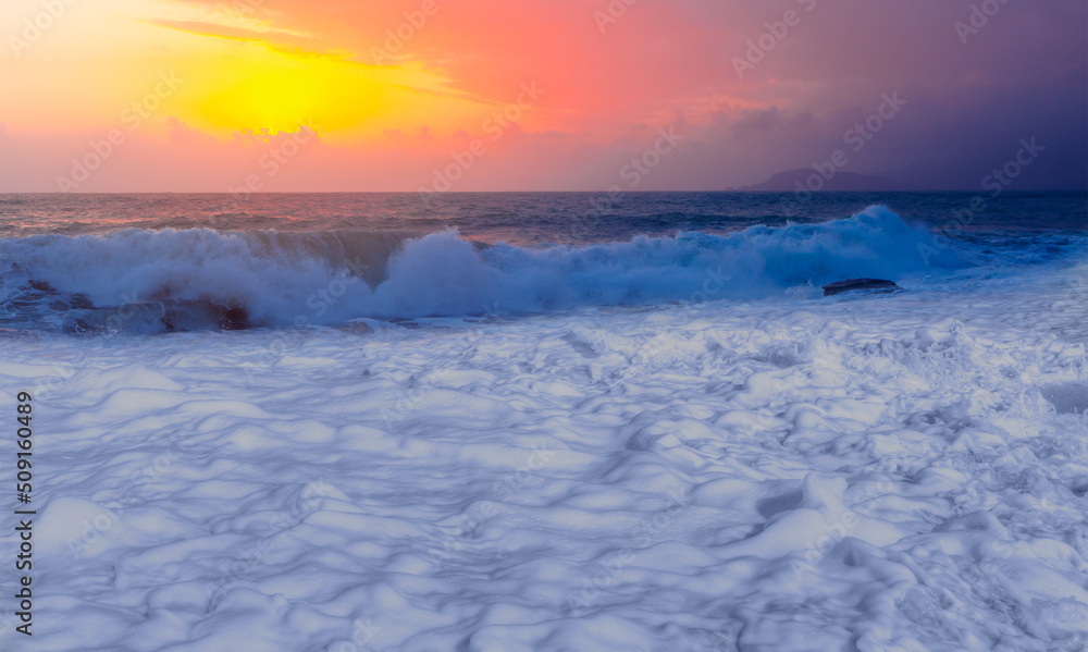 Famous amazing sunset and white sea foam on a Mediterranean dusk - Alanya, Antalya