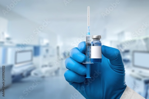Injectable vaccine for the vaccination program of coronavirus Omicron. Doctor holds the syringe