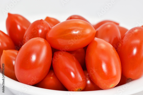 Porcelain dish of red cherry tomatoes