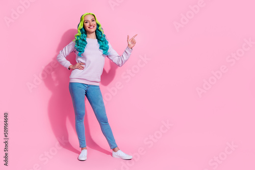 Full size photo of positive good looking female point finger blank space give recommendation isolated on pink color background © deagreez