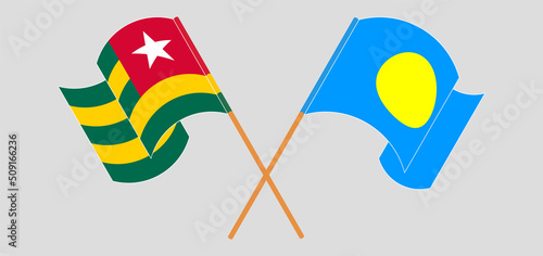 Crossed and waving flags of Togo and Palau