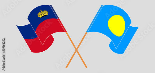 Crossed and waving flags of Liechtenstein and Palau