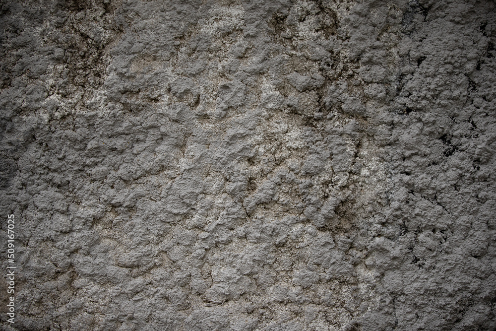 Obraz premium Closeup of vintage gray wall texture. Old stone wallpaper. A cleaned painted wall with cements and a textured background. Abstract web banner. Copy space