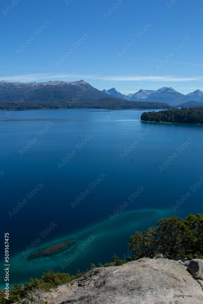 view of bahia brava viewpoint Villa Langostura, Patagonia Argentina, blue lake and mountains