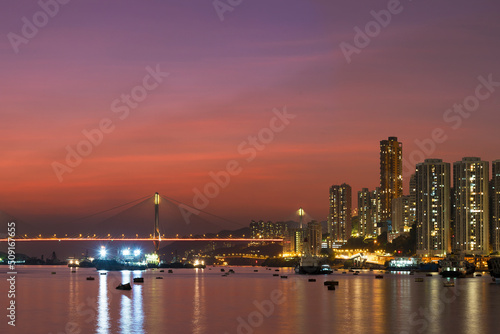 Idyllic landscape of harbor and skyline of Hong Kong city at dusk © leeyiutung