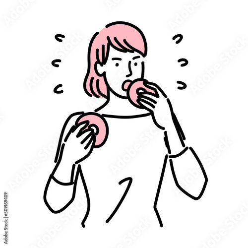甘いものをガツガツ食べている若い女性