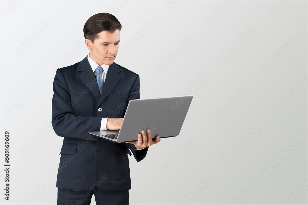 Successful young man student freelancer using laptop, Successful young man student freelancer using laptop,