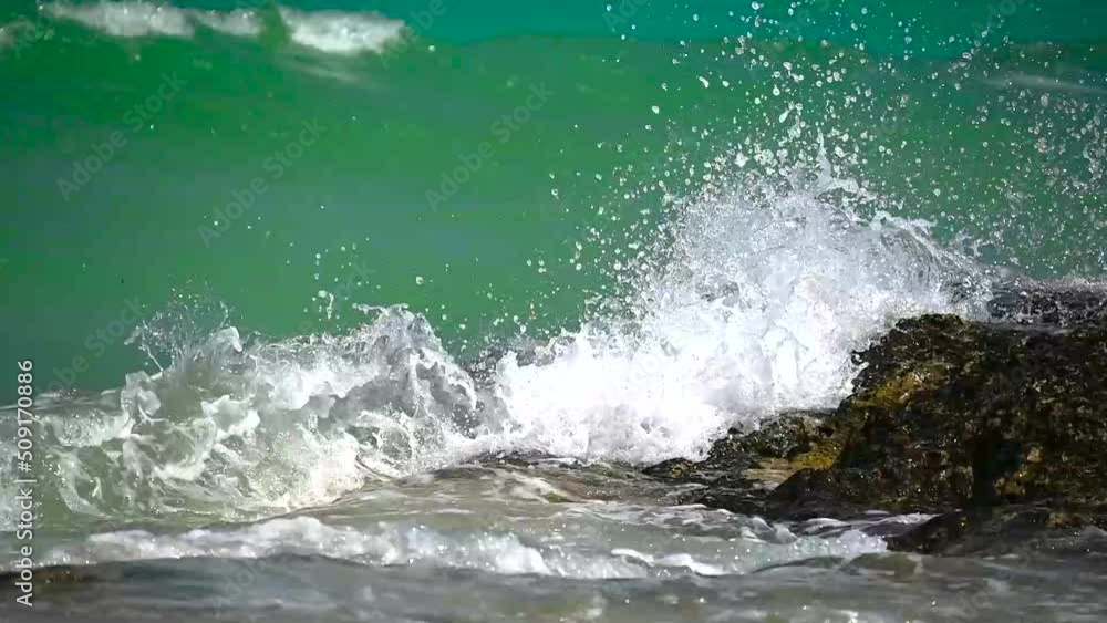 Waves crashing onto a rock. Waves crashing onto a rock.