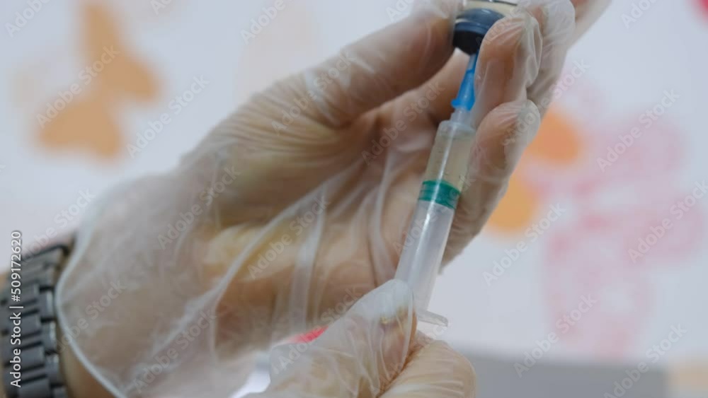 Doctor Takes COVID-19 Vaccine Into Syringe. Coronavirus Vaccination. Doctor Takes COVID-19 Vaccine Into Syringe. Coronavirus Vaccination.