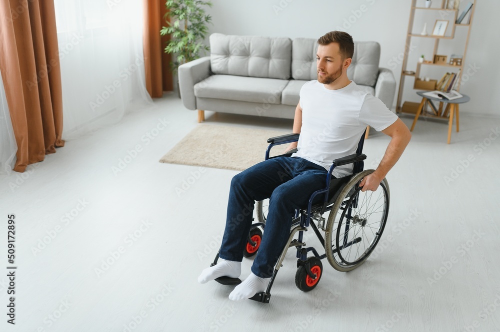 Young handsome man in wheelchair. Young handsome man in wheelchair.