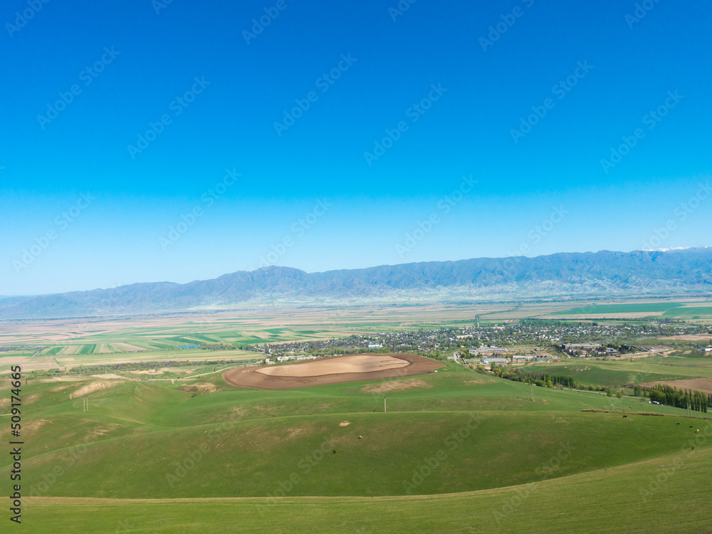 Green slopes and blue skies. Kyrgyzstan. tourism and travel