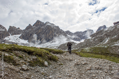 man trekking in the mountains, Alps in Austria, Lienzer Dolomiten © Mira Drozdowski