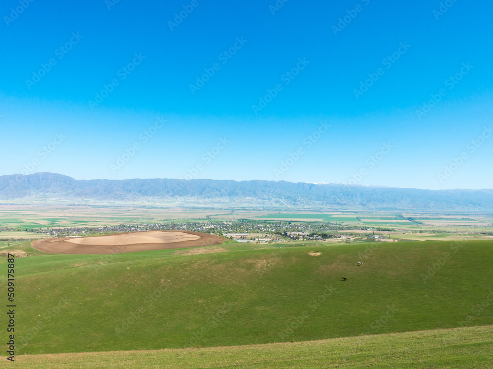 Green slopes and blue skies. Kyrgyzstan. tourism and travel