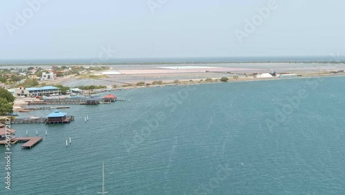 Las Calderas bay with salt pants in background, Dominican Republic. Aerial forward photo