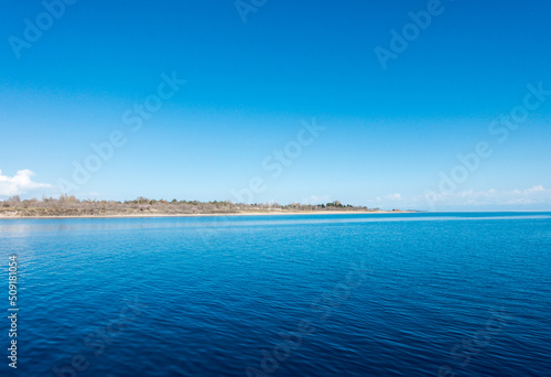 Blue sea water. Water and sky. Natural ocean surface background on the sky.