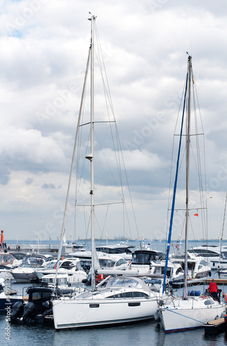 White yachts on the mooring of the mall in Sopot © Yana Staryk