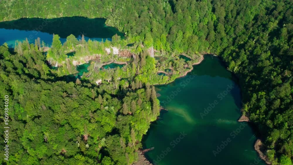 Aerial view of Plitvice lakes croatia, national park holiday travel destination, pristine water lake in mountains unpolluted scenery landscape during a sunny day Aerial view of Plitvice lakes croatia, national park holiday travel destination, pristine water lake in mountains unpolluted scenery landscape during a sunny day