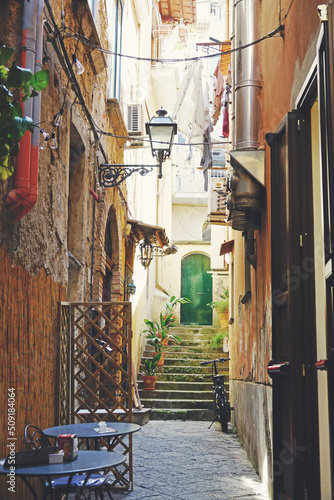 Fototapeta Naklejka Na Ścianę i Meble -  Narrow street in Sorrento old town, with charming italian atmosphere