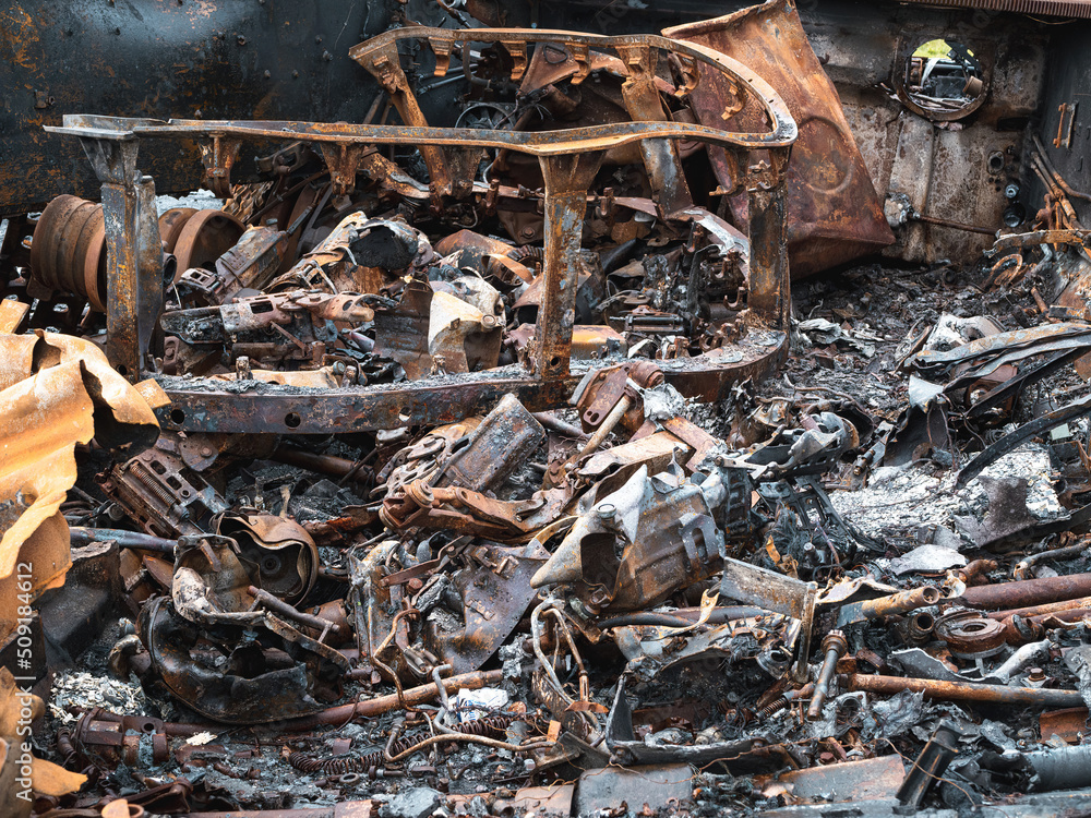 The war in Ukraine, an exploded tank, a pile of metal parts in the body of a torn tank The war in Ukraine, an exploded tank, a pile of metal parts in the body of a torn tank