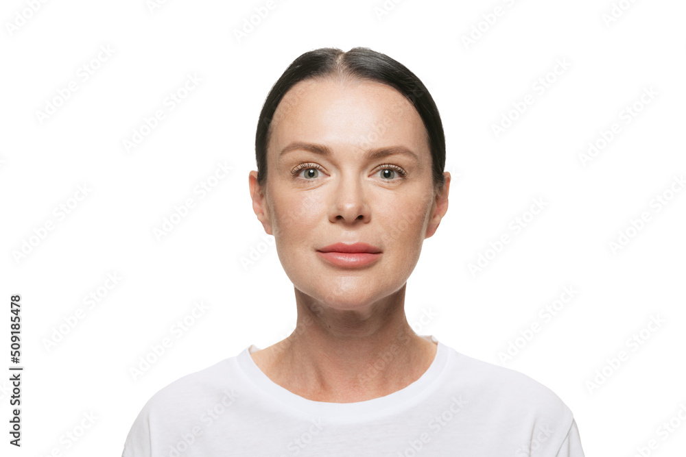 Half-length portrait of happy middle age beautiful woman with well-kept skin on white background. Cosmetics, spa, age-related changes, face lifting and skin care concept Half-length portrait of happy middle age beautiful woman with well-kept skin on white background. Cosmetics, spa, age-related changes, face lifting and skin care concept