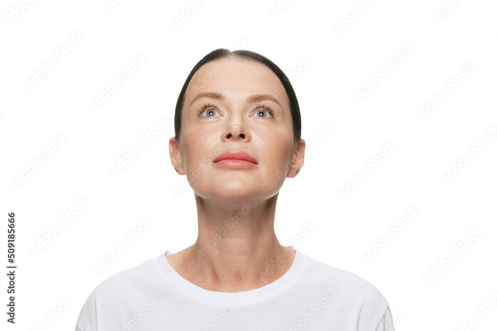 Half-length portrait of happy middle age beautiful woman with well-kept skin on white background. Cosmetics, spa, age-related changes, face lifting and skin care concept Half-length portrait of happy middle age beautiful woman with well-kept skin on white background. Cosmetics, spa, age-related changes, face lifting and skin care concept