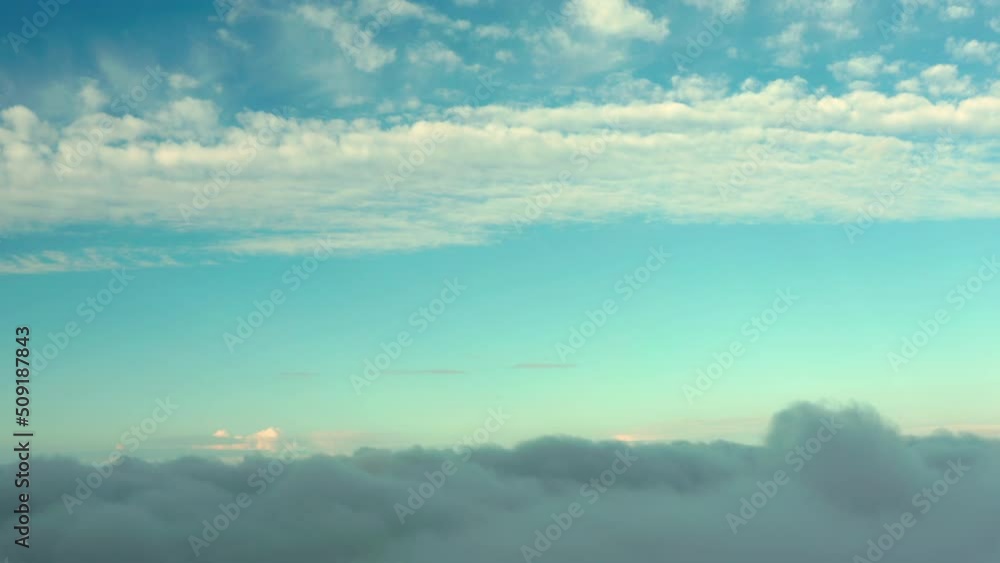 Fluffy clouds in the Azure Sky: a layer on the bottom and a layer on top with a clear space in the middle: amazing landscape. Fluffy clouds in the Azure Sky: a layer on the bottom and a layer on top with a clear space in the middle: amazing landscape.
