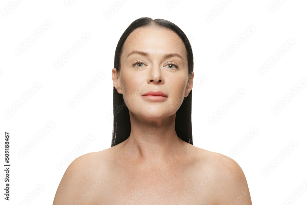 Beauty portrait of happy 44 years old beautiful woman with well-kept skin on white background. Cosmetics, spa, age-related changes, face lifting and skin care concept Beauty portrait of happy 44 years old beautiful woman with well-kept skin on white background. Cosmetics, spa, age-related changes, face lifting and skin care concept