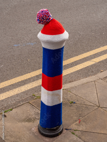 Hand Knitted decorations by the 'Yarn Bombers' of the Holmes Chapel village to celebrate the Queens Platinum Jubilee Celebrations, Holmes Chapel, Cheshire UK photo