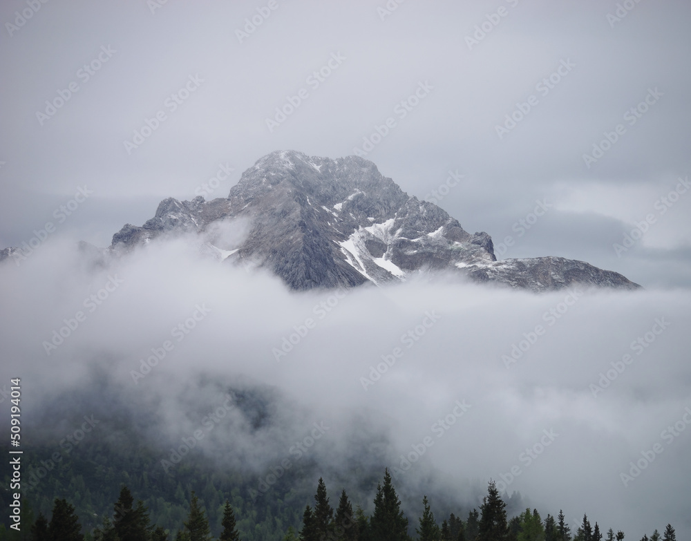 Close-up view of the top of the Kamnik Alps with the surrounding mist from Velika Planina, Slovenia