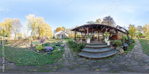 Full seamless 360 degree HDRI spherical panorama. House with a large green lawn, a bathhouse and a patio, an eco-farm for guests, sunny weather with blue sky 
