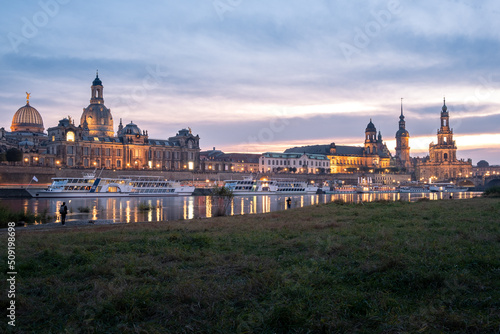 View from the Königsufer to the skyline from the oldtown from the city Dresden with the Frauenkirche at sunset.