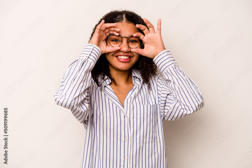Young African American woman isolated on white background excited keeping ok gesture on eye. Young African American woman isolated on white background excited keeping ok gesture on eye.