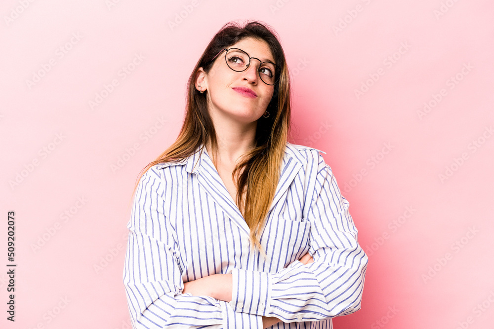 Young caucasian woman isolated on pink background dreaming of achieving goals and purposes Young caucasian woman isolated on pink background dreaming of achieving goals and purposes