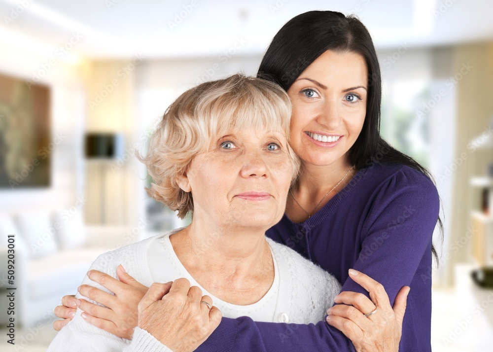 Happy woman spending time with her elderly mother. Happy woman spending time with her elderly mother.