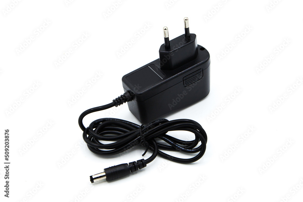 Charger isolated on white background. AC - DC Adapter. Charger isolated on white background. AC - DC Adapter.