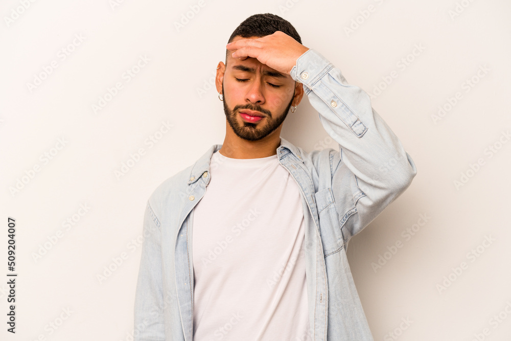 Young hispanic man isolated on white background touching temples and having headache. Young hispanic man isolated on white background touching temples and having headache.